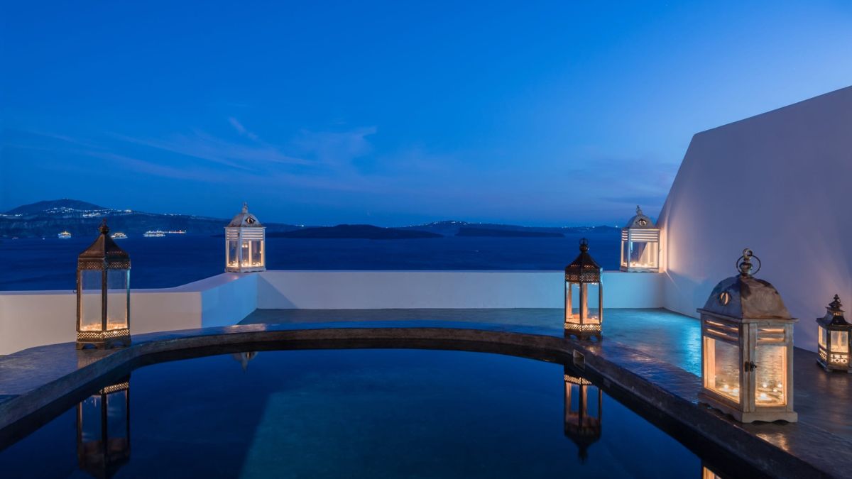 A serene outdoor terrace at Andronis Luxury Suites, a luxury hotel in Santorini Greece.