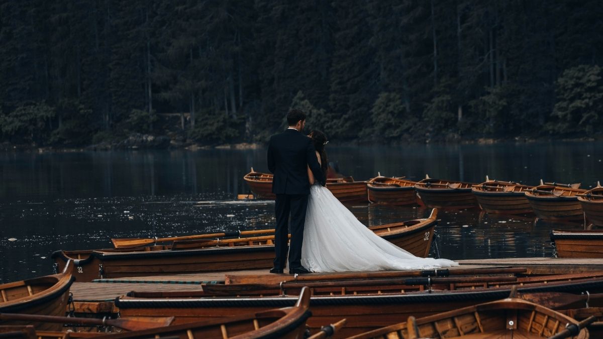 Couple exchanging vows on the deck of a private yacht at sea, luxury yacht wedding