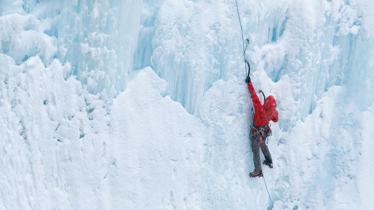 Guests learning to ice climb in the arctic with a professional guide
