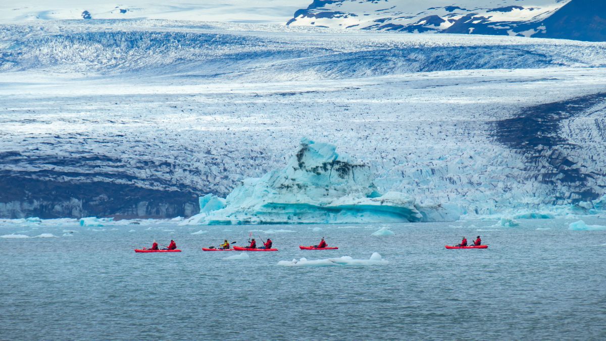 5 kayaks in Iceland next to a glacier, an experience part of our vip concierge service