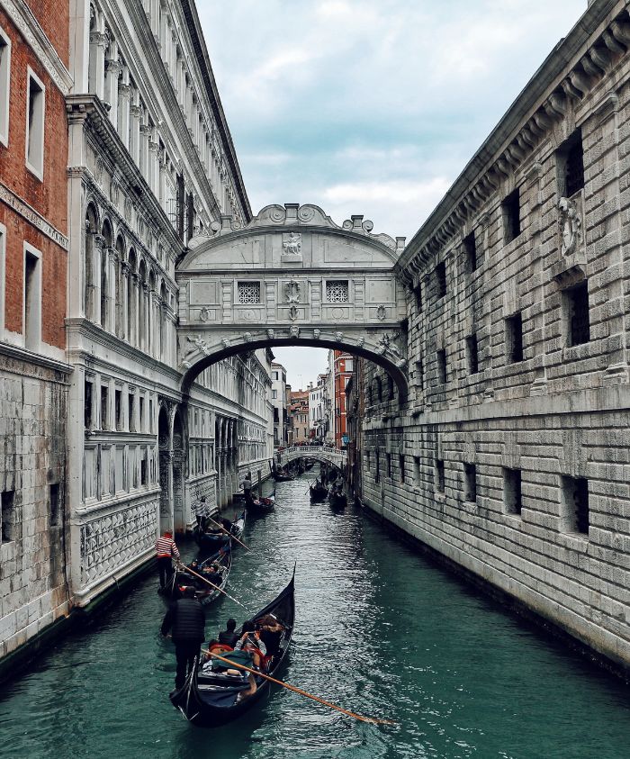 Gondolas on a Venice canal beneath the Bridge of Sighs