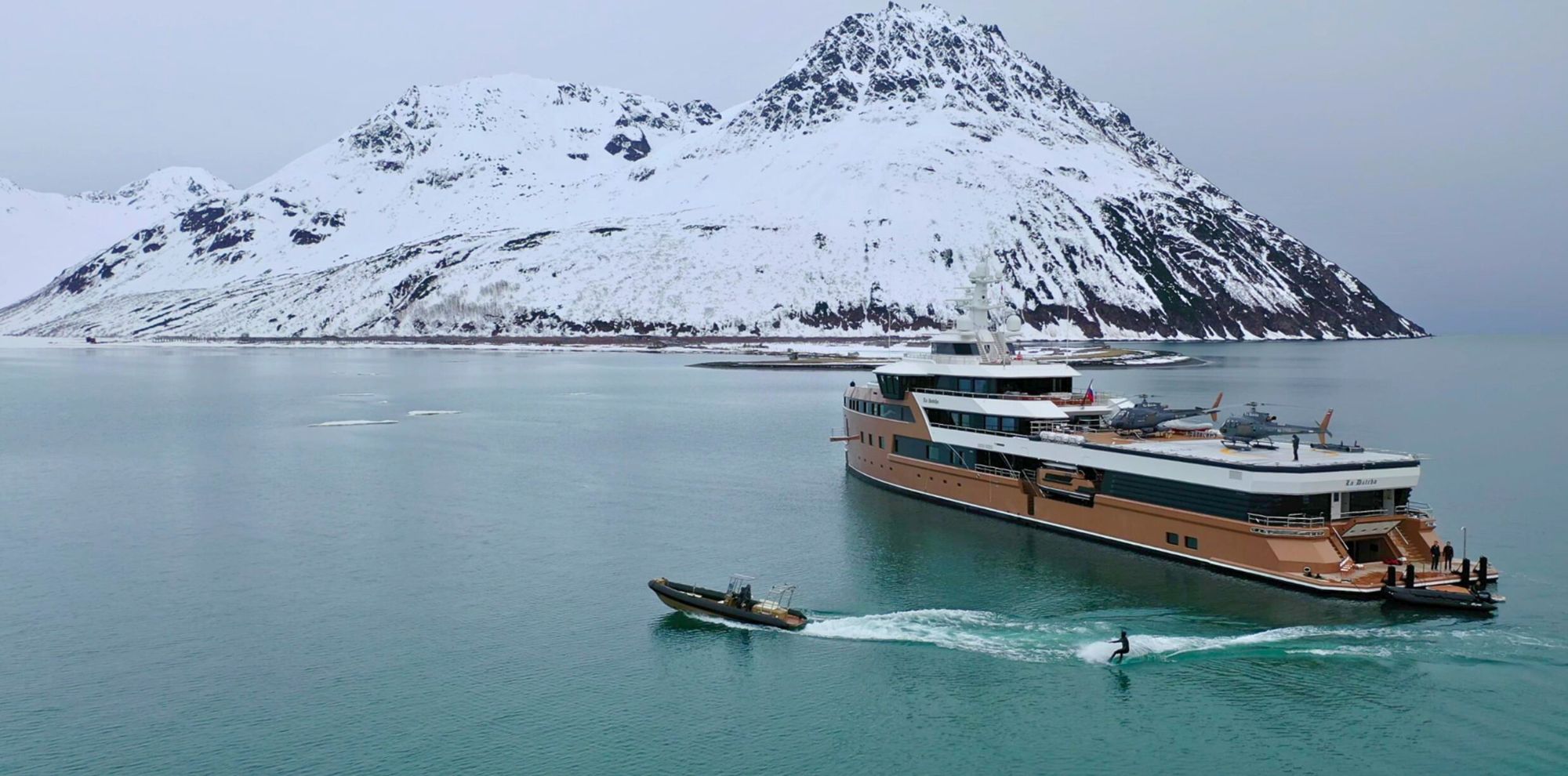 boat in front of mountains