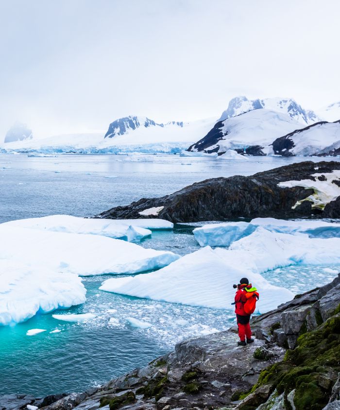 Man looking out to sea in Antarctica