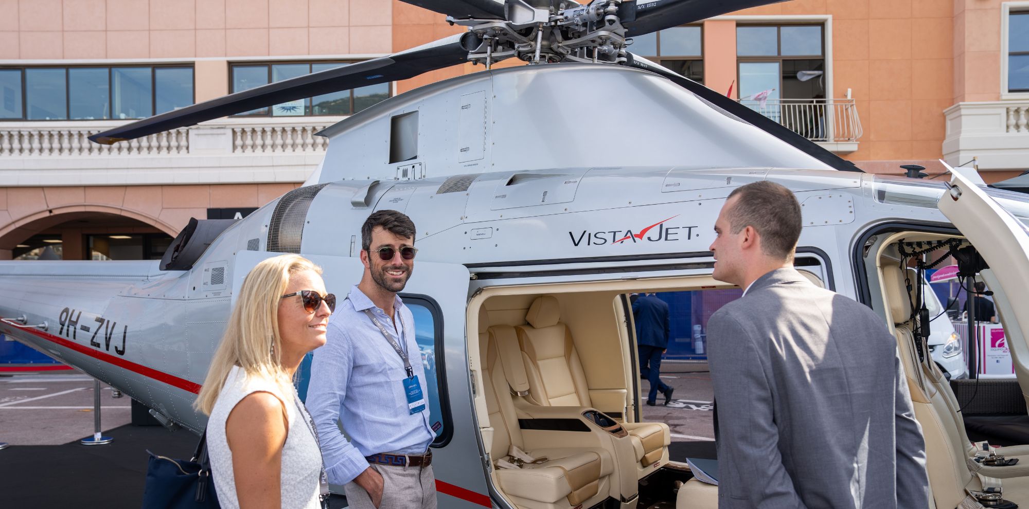 parters pictured with helicopter smiling