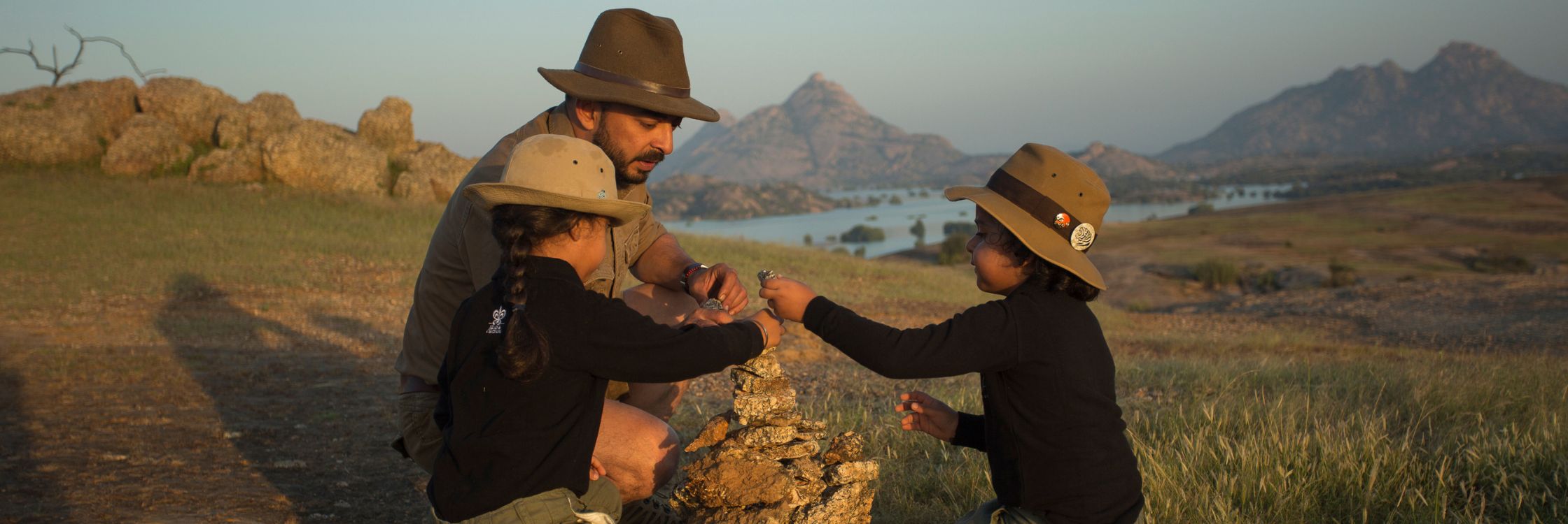 Child and guide in the Indian countryside at sunset, an immersive India experience