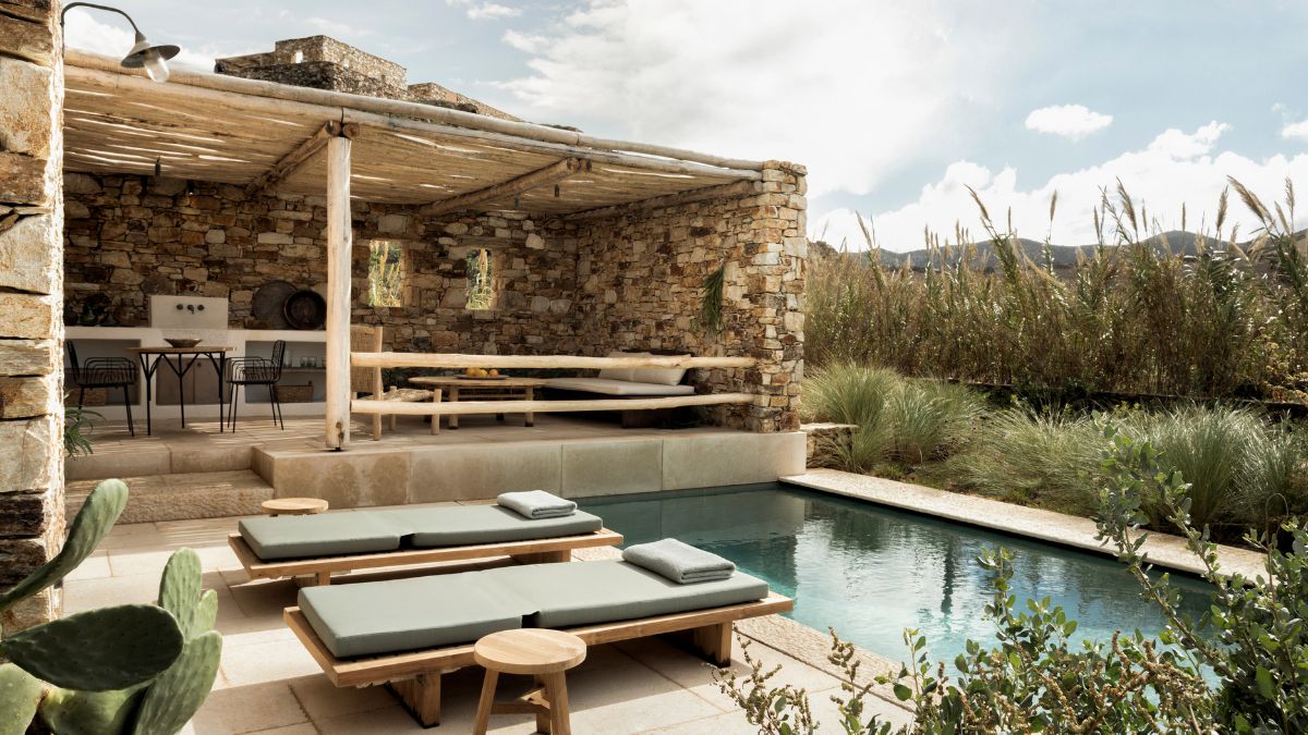 Serene pool area at The Rooster, a luxury hotel in Greece