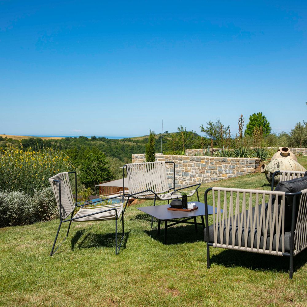 outside table and chairs on the hillside