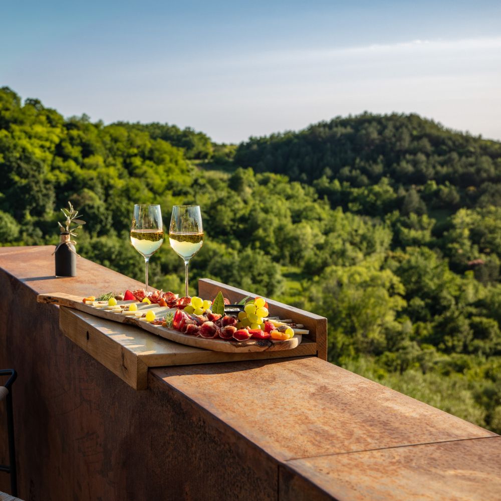 wine and grape platter on a balcony