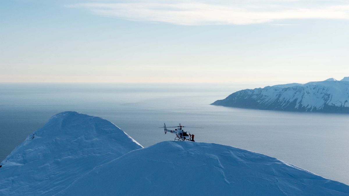 Luxury private helicopter tour over Iceland’s snowy peaks, an unforgettable experience in a bespoke Iceland family vacation.
