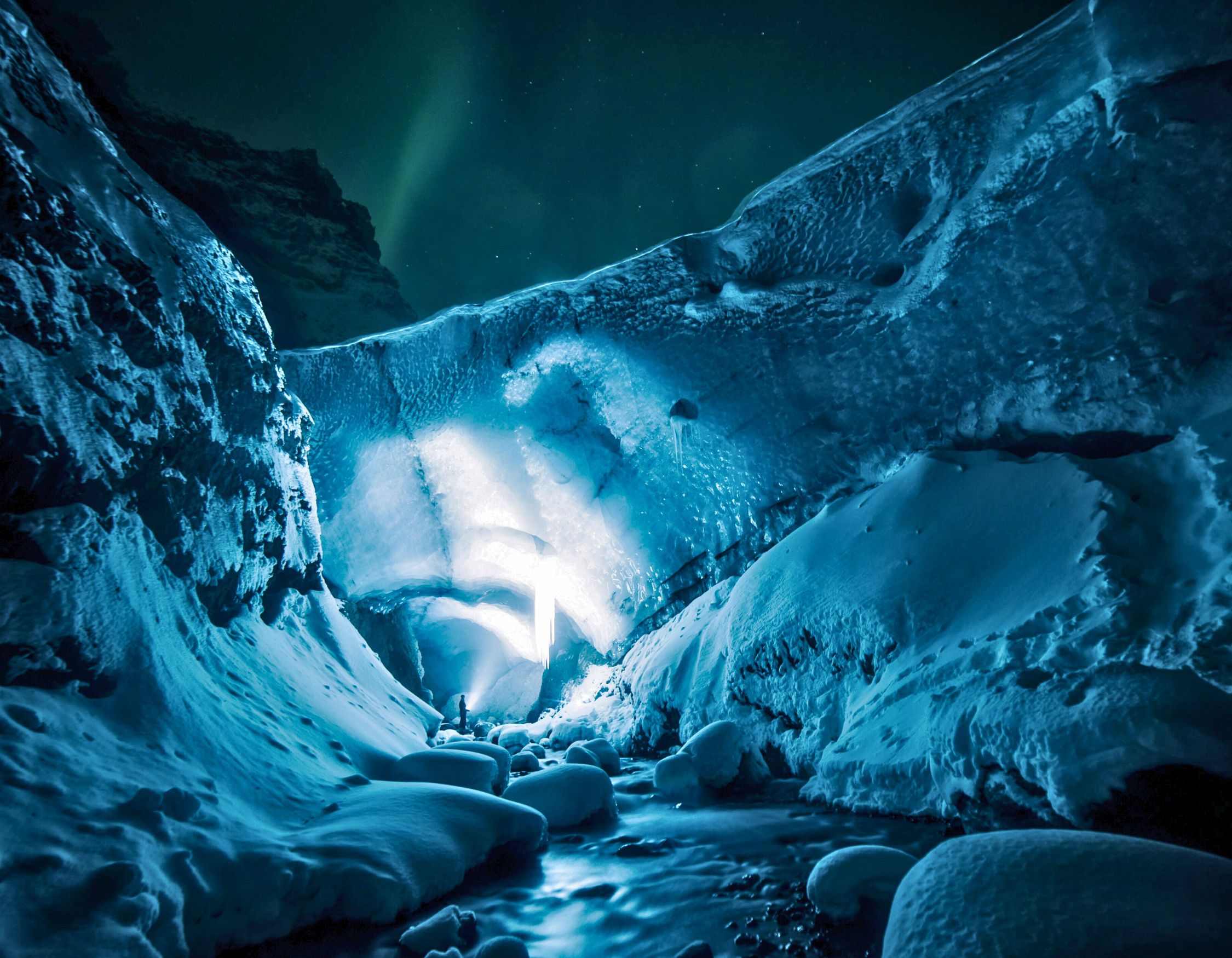 Blue ice cave interior on a luxury private tour, a highlight of luxury Iceland vacations.