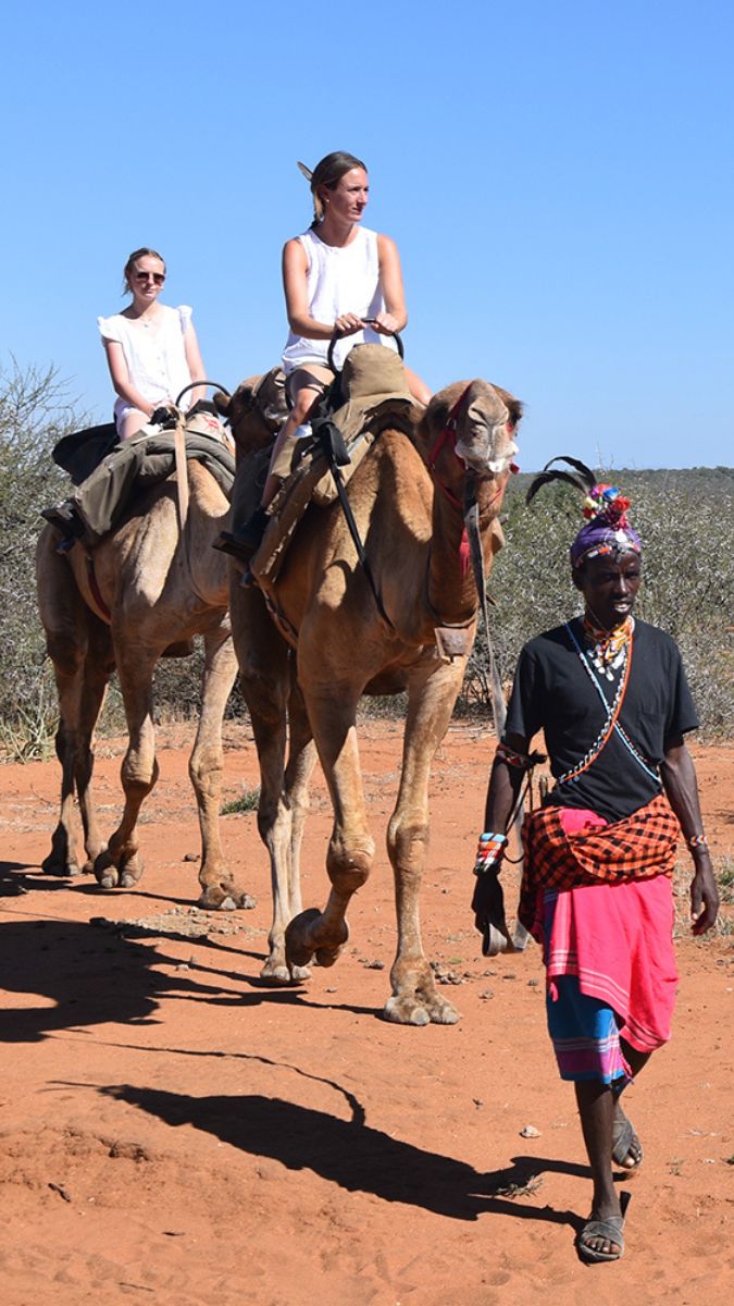 Bella riding a camel