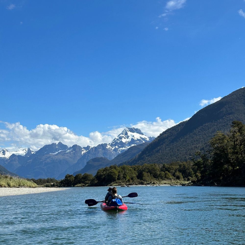 two people kayaking on a lake