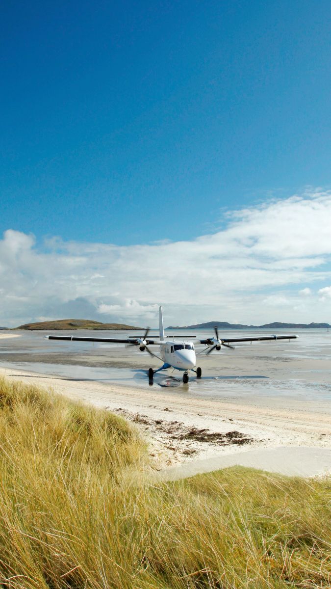 travel concierge private plane on beach in Scotland