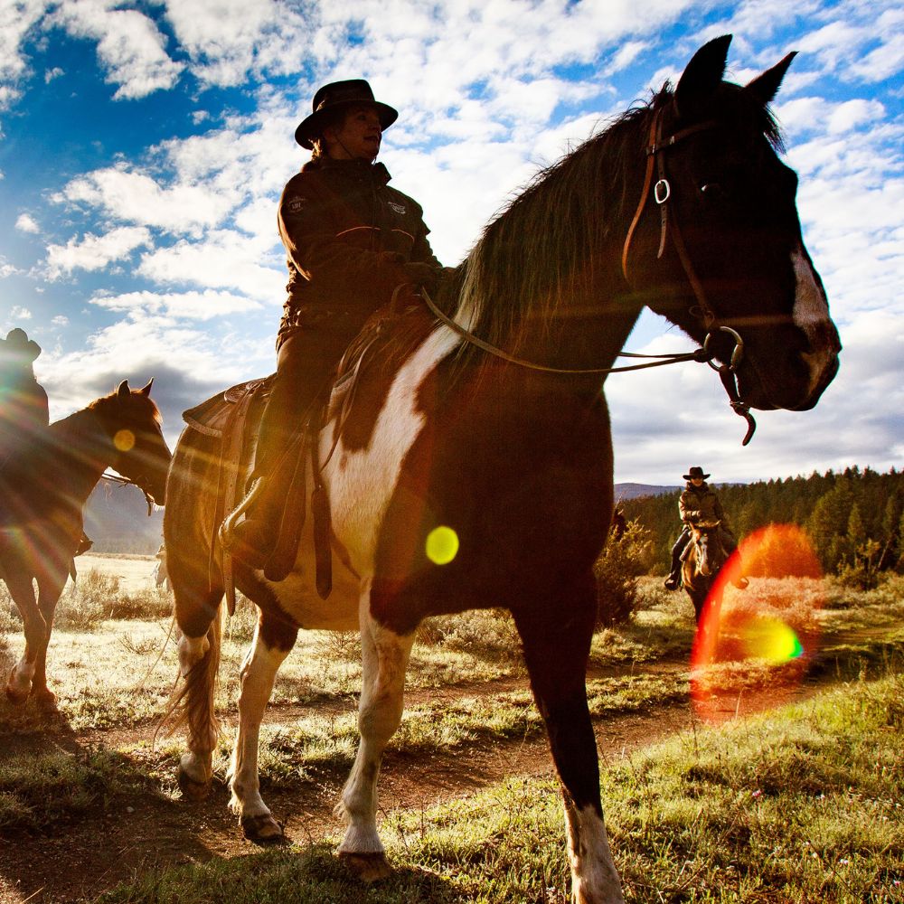 Guest horse riding on a ranch in Montana, among one of the best things to do in Montana in the summer