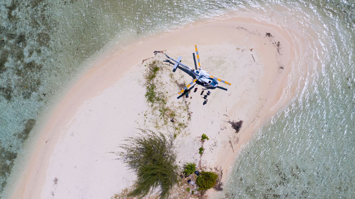 Helicopter on remote stretch of sand in Solomon islands